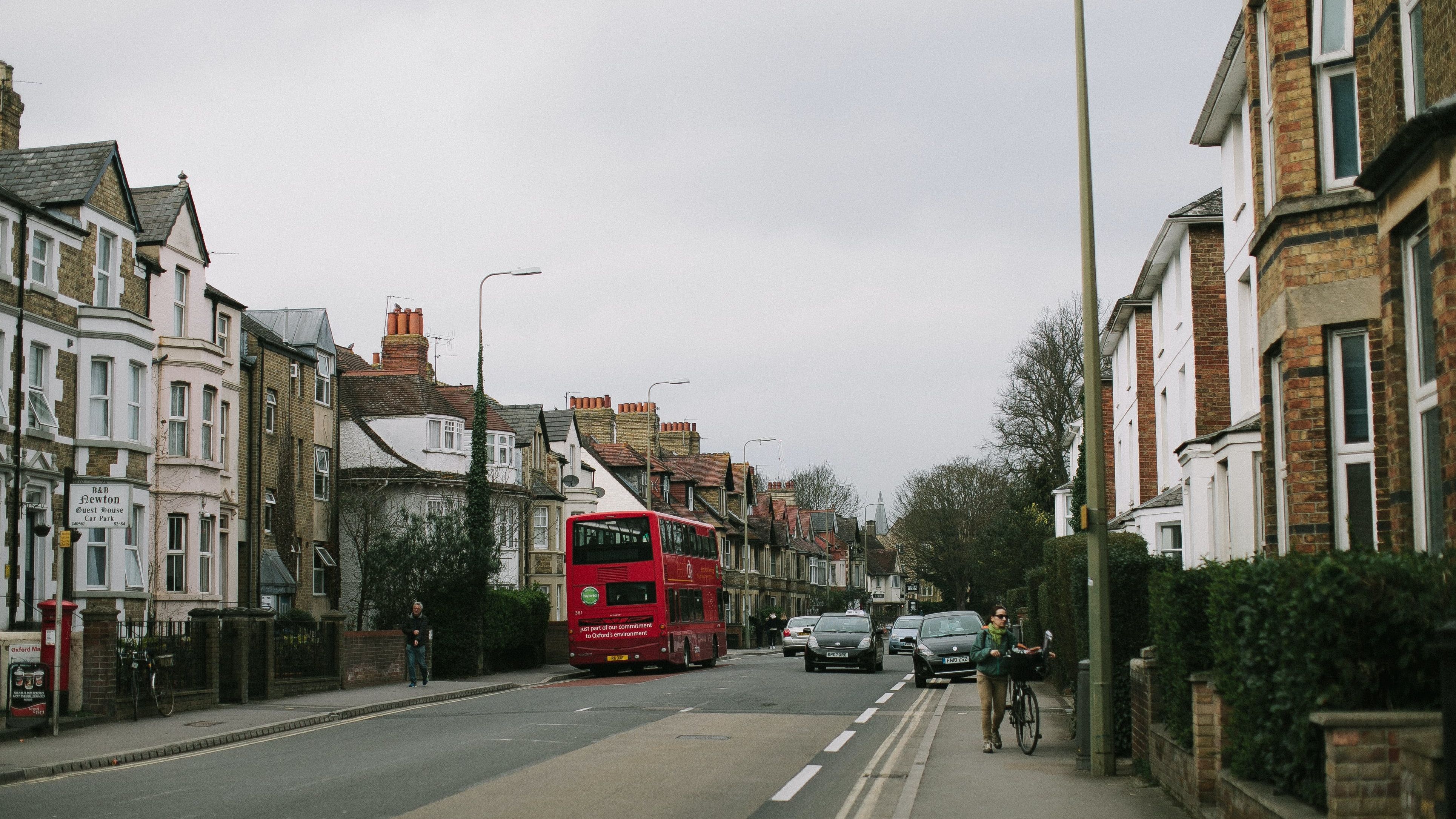 Street in England with a red bus